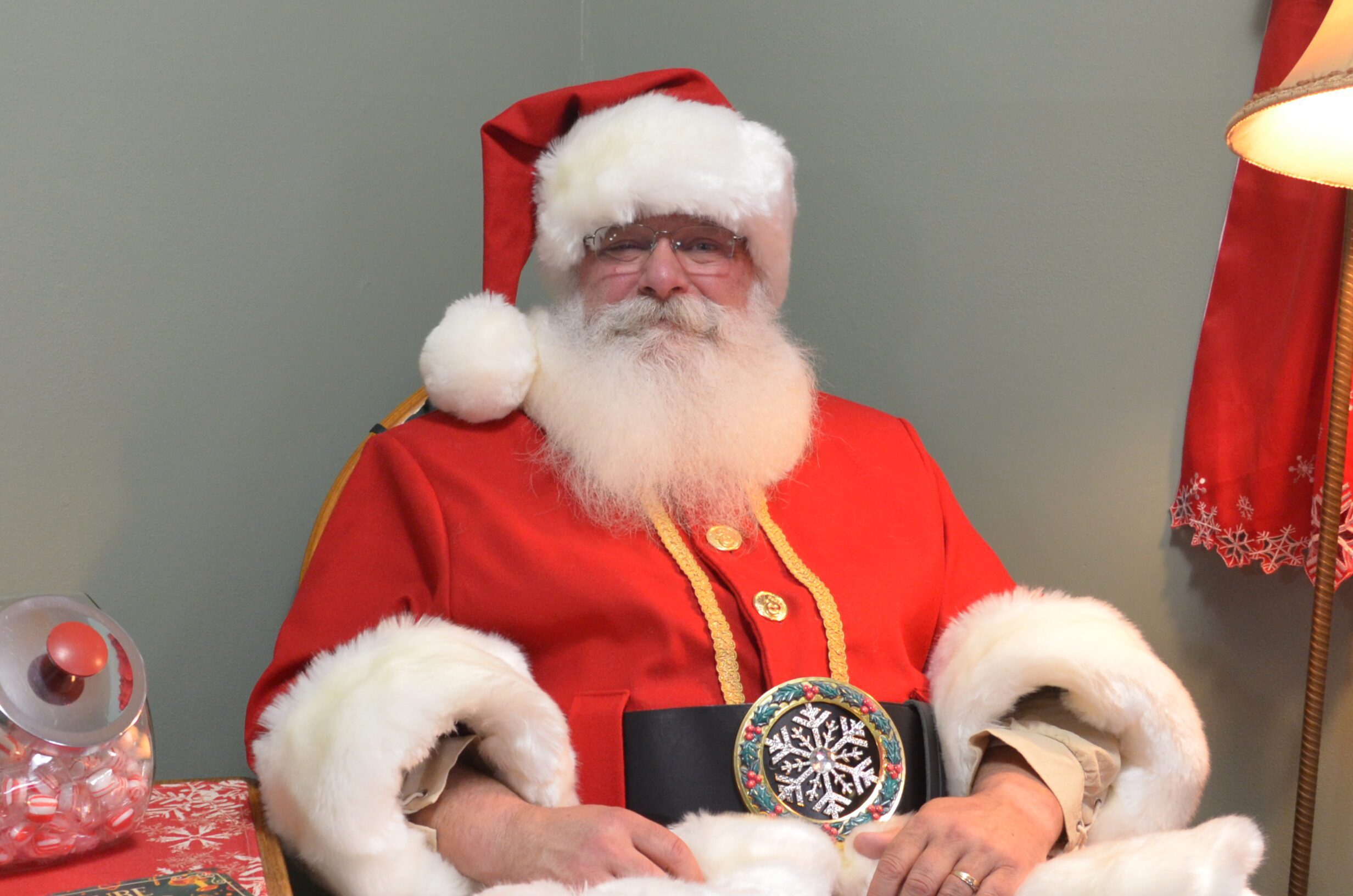 Santa Tom Posing for Photo before a Christmas Celebration