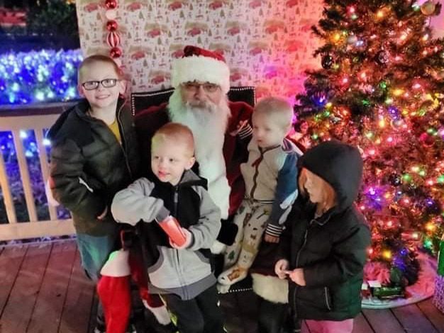 Santa Tom visiting with children during a Christmas meet-and-greet in Central Missouri.