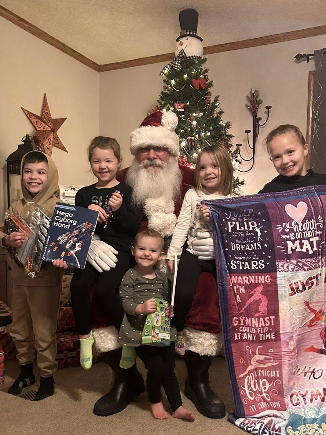 Santa Tom adding joy and laughter to a family Christmas celebration